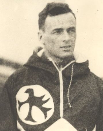 Bill Tart wearing Red Birds Ski Club jacket and logo