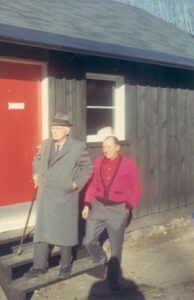 Sigurd Lockeberg (left) standing outside the Riders Roost, the newly built lodge for the Trail Riders of Camp Fortune in Old Chelsea, Quebec.