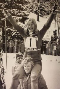 Kathy Kreiner celebrates her gold medal victory (giant slalom) with "Jungle" Jim Hunter at 1976 Innsbruck Olympic Winter Games.