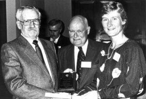 Gault Gillespie (left) with Canadian Ski Museum Chair, Bill Tindale, and Kathy Kreiner at 1987 Canadian Ski Hall of Fame Induction Ceremony.