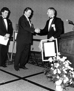 Inductee Andy Tommy with Canadian Ski Museum Chair, Erle Bergh, at 1990 Canadian Ski Hall of Fame Induction Ceremony