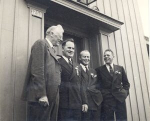 [L to R]: Harry Wade Hicks, Roger Langley (President of US Ski Association), ?, ?