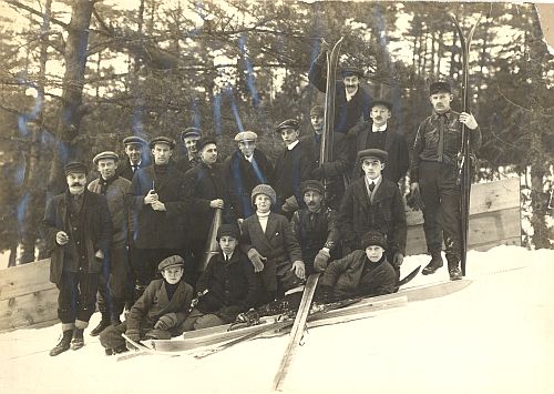 Group of skiers including [left to right]: Alex Olson, Arthur Pineault (8th from left) and Sigurd lockeberg (far right) c.1910