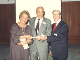 [L to R]: Gaby Pleau, Inductee Harry Pangman, and Louis Grimes at 1983 Canadian Ski Hall of Fame Induction Ceremony at the Calgary Petroleum Club