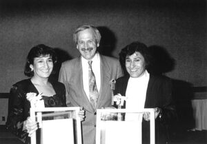 Inductees Sharon and Shirley Firth with Allen Warren, a director of the Canadian Ski Museum, at the 1990 Canadian Ski Hall of Fame Induction Ceremony