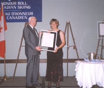 Keith Nesbitt, Canadian Ski Museum Chair, with Inductee Liisa Savijarvi at 1997 Canadian Ski Hall of Fame Induction Ceremony
