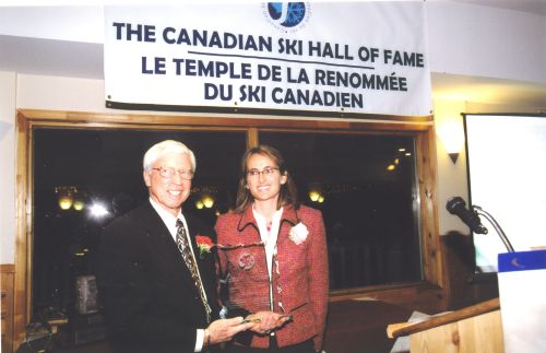 Canadian Ski Museum Chairman, Arnold Midgley, and inductee Lucie Barma at 2004 Canadian Ski Hall of Fame Induction Ceremony.
