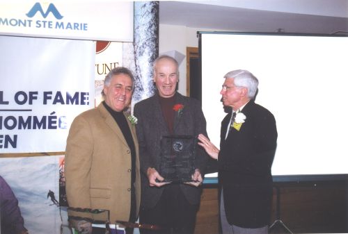 [L to R]: Master of Ceremonies, Peter Duncan, with Inductee Bob Gilmour and Canadian Ski Museum Chair, Arnold Midgley, at 2003 Canadian Ski Hall of Fame Induction Ceremony.