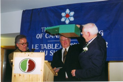 Master of ceremonies Peter Duncan (left), Glenn Pushman, and Keith Nesbitt (right) at 2002 Canadian Ski Hall of Fame Induction Ceremony.