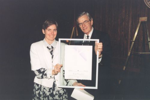 Judy Crawford (left) with Canadian Ski Museum Chair, Grant Boyd, at 1995 Canadian Ski Hall of Fame Induction Ceremony.
