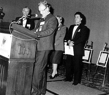 Inductee Pepi Salvenmoser (at podium) and Master of ceremonies, Peter Duncan (right), at 1990 Canadian Ski Hall of Fame Induction Ceremony
