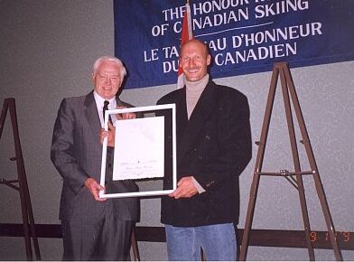 Keith Nesbitt, Canadian Ski Museum Chair, with Inductee Jean-Marc Rozon at 1997 Canadian Ski Hall of Fame Induction Ceremony